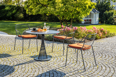 Claris table and Claris armchair Claris table and Claris armchair